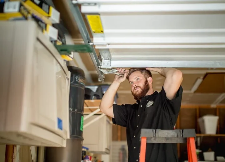 Technician working on a garage door